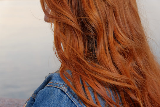 Ginger haired woman rear view closeup image