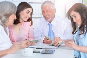 Fototapeta premium Four businessmen working together 