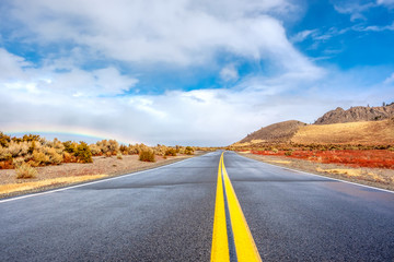 Open highway and rainbow