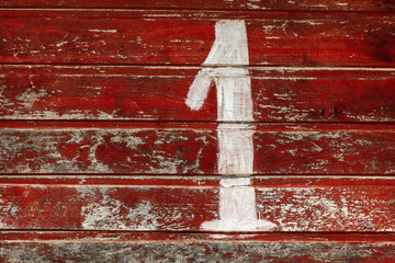 One digit on vintage boards with remnants of red paint