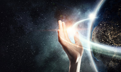 Earth planet in palm . Mixed media