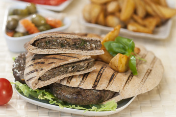 Egyptian Hawawshi  with pita bread and salad