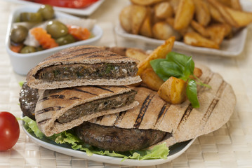 Egyptian Hawawshi  with pita bread and salad