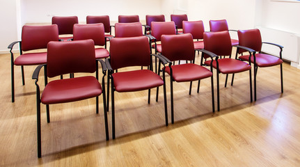 Padded red chairs.