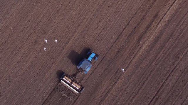 Aerial view of tractor on Prepare a field for planting