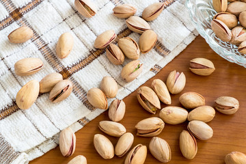 pistachios seed nut on the wooden table, healthy pistachios nuts with nature tasty.