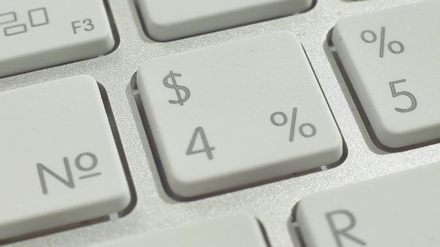 Macro video of keyboard number and function buttons. Man press the button.