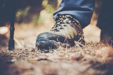 Close up of man feet while hiking in nature.