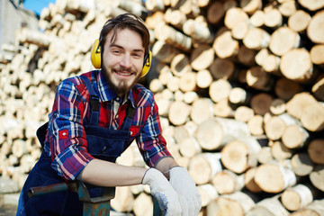 Happy tree-service worker looking at camera