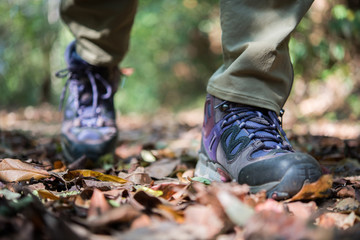 Close up of man feet while hiking in nature.