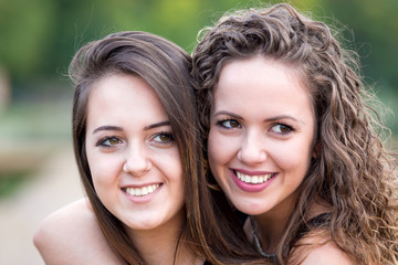 sisters on lake pier