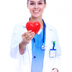 Positive female doctor standing with stethoscope and red heart symbol