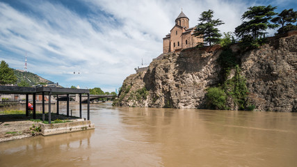 Metekhi church on the high cliff over the Kura River. Tbilisi, the capital and the largest city of Georgia. Famous touristic landmark. © Alex Reshnya