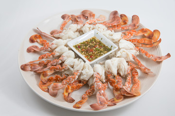 crab paddle-leg in white dish served with spicy sauce