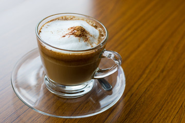 Cappuccino cup on wooden table