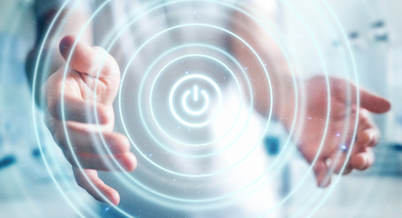 Businessman holding 3D render power button with his hand