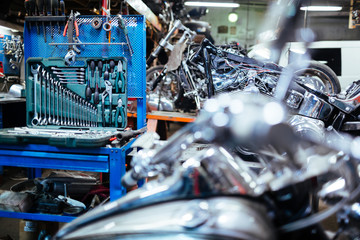 Background image of empty mechanics workshop with opened toolbox set for car repairings