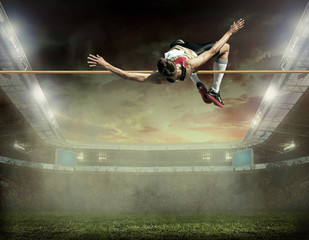 Fototapeta na wymiar Athlete in action of high jump.