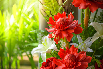 Bunch of beautiful flowers decoration include torch ginger and white lily with natural background.