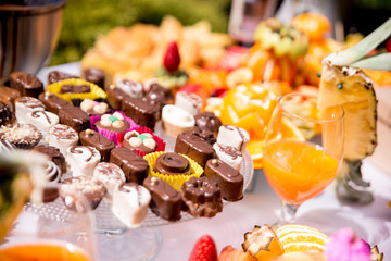 assorted sweets on party table outdoor 