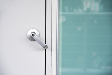 Exterior modern style door handle and security key lock on the door