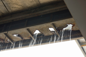 rusty and decay roof gutter , the rain water is leaking