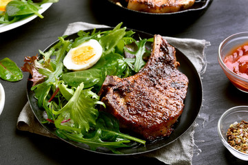 Fried pork steak with green salad