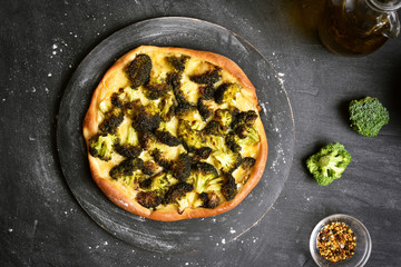 Pizza with broccoli, top view