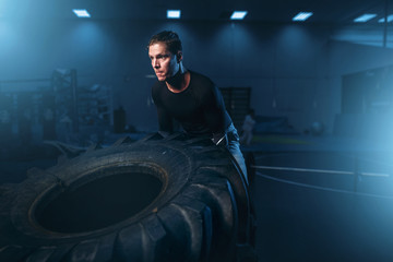 Plakat Athlete on training, workout with heavy tire