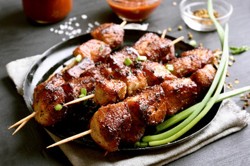 Grilled meat on wooden skewers