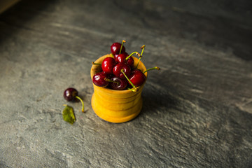 Sweet cherries on rustic wooden background