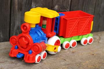 Obraz premium Multi-colored plastic locomotive in nature