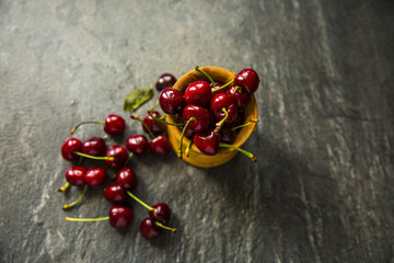 Sweet cherries on rustic wooden background