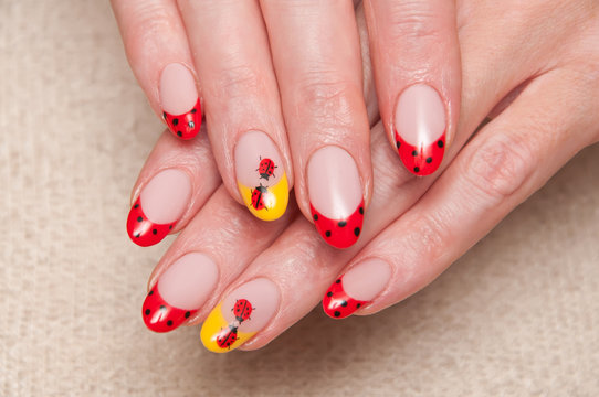 Red French manicure, Points on nails. Yellow nameless mantle. Ladybugs on nails. Oval shape of the nails. 