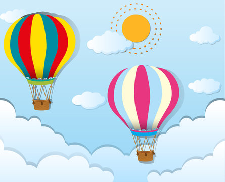 Two balloons flying in blue sky