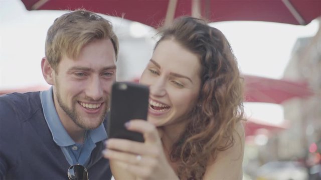 Couple looking at smart phone together