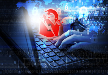 Security internet concept of woman using laptop with warning key