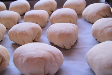 sweet cakes on the baking sheet, the dough on a baking sheet, the dough used to make fresh, homemade delicious muffins
