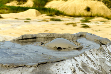 Bubbling mud volcano in Berca, Romania