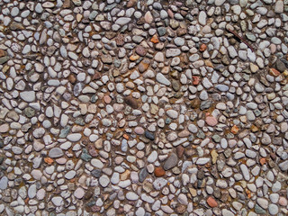 The texture of the road lined with small pebbles