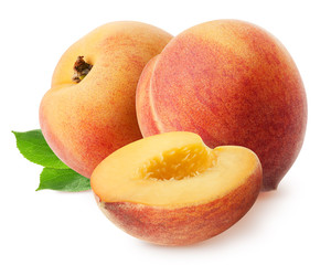 Peach isolated. Two whole peach fruits with piece and leaves isolated on white with clipping path