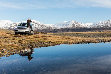 Man explorer in Iceland sitting on the car © william87
