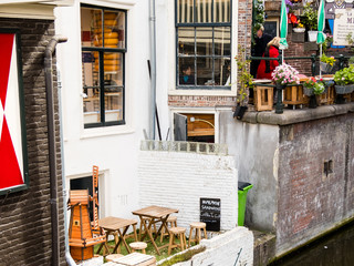 A small street cafe in Amsterdam, a view of the canal