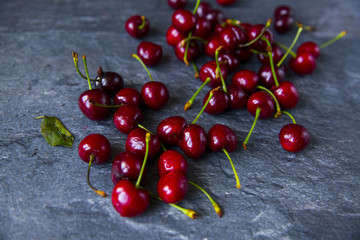 Sweet cherries on rustic wooden background