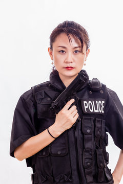 Chinese woman police officer with pistol