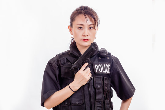 Chinese woman police officer with pistol