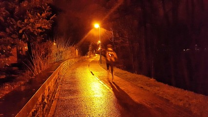 Ghost runner under orange light