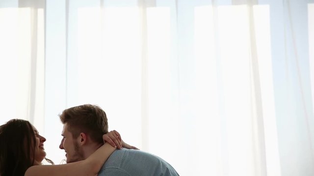 Beautiful couple in love having fun at home