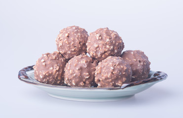 chocolate ball or chocolate bonbon on a background.
