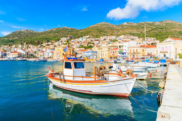 Fototapeta na wymiar Typical fishing boat in Vathy port on beautiful summer day, Samos island, Greece